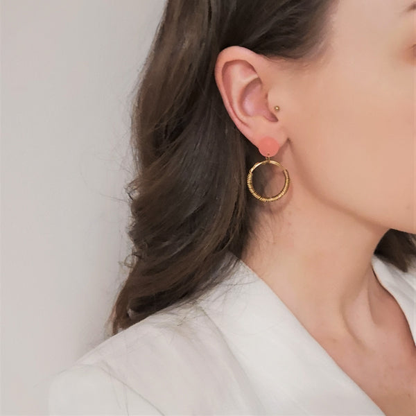 Wrapped 18 carat gold vermeil and pink acrylic hoop earrings model