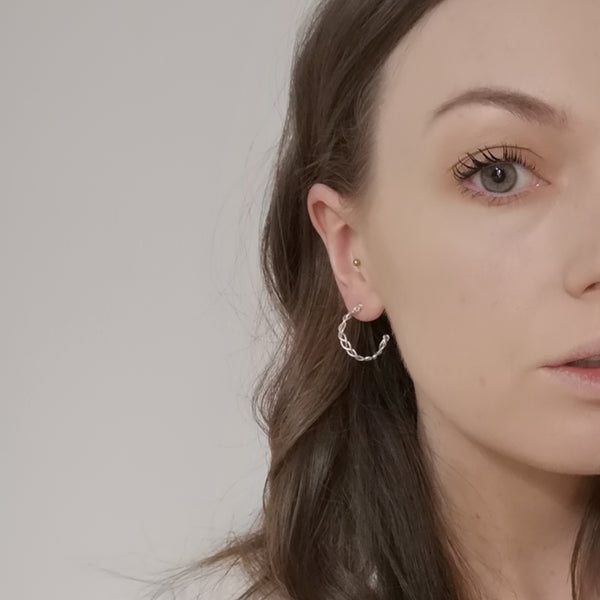 Solid silver plait hoop earrings model