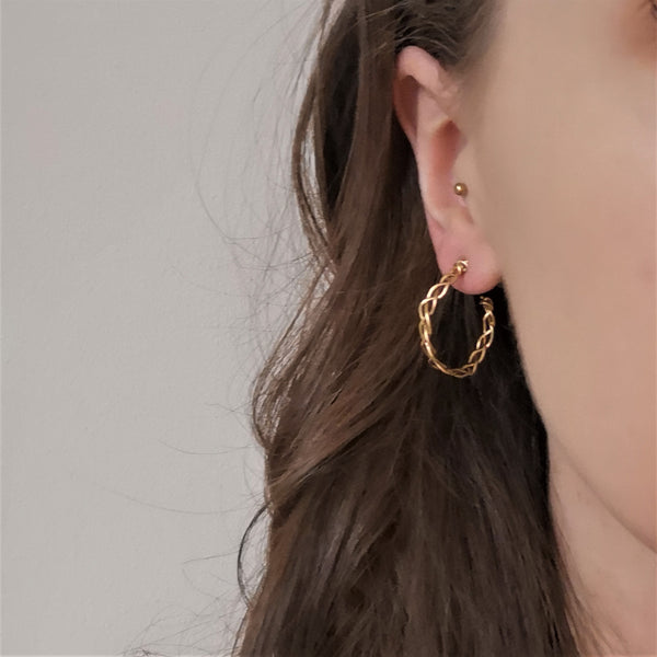 Gold plait hoop earrings model