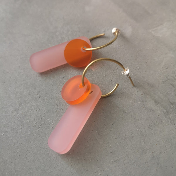 Gold hoop earrings with pink and orange acrylic