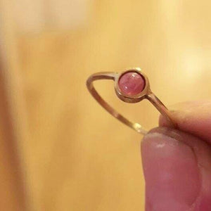 Simple minimal solid gold pink rhodocrosite ring.